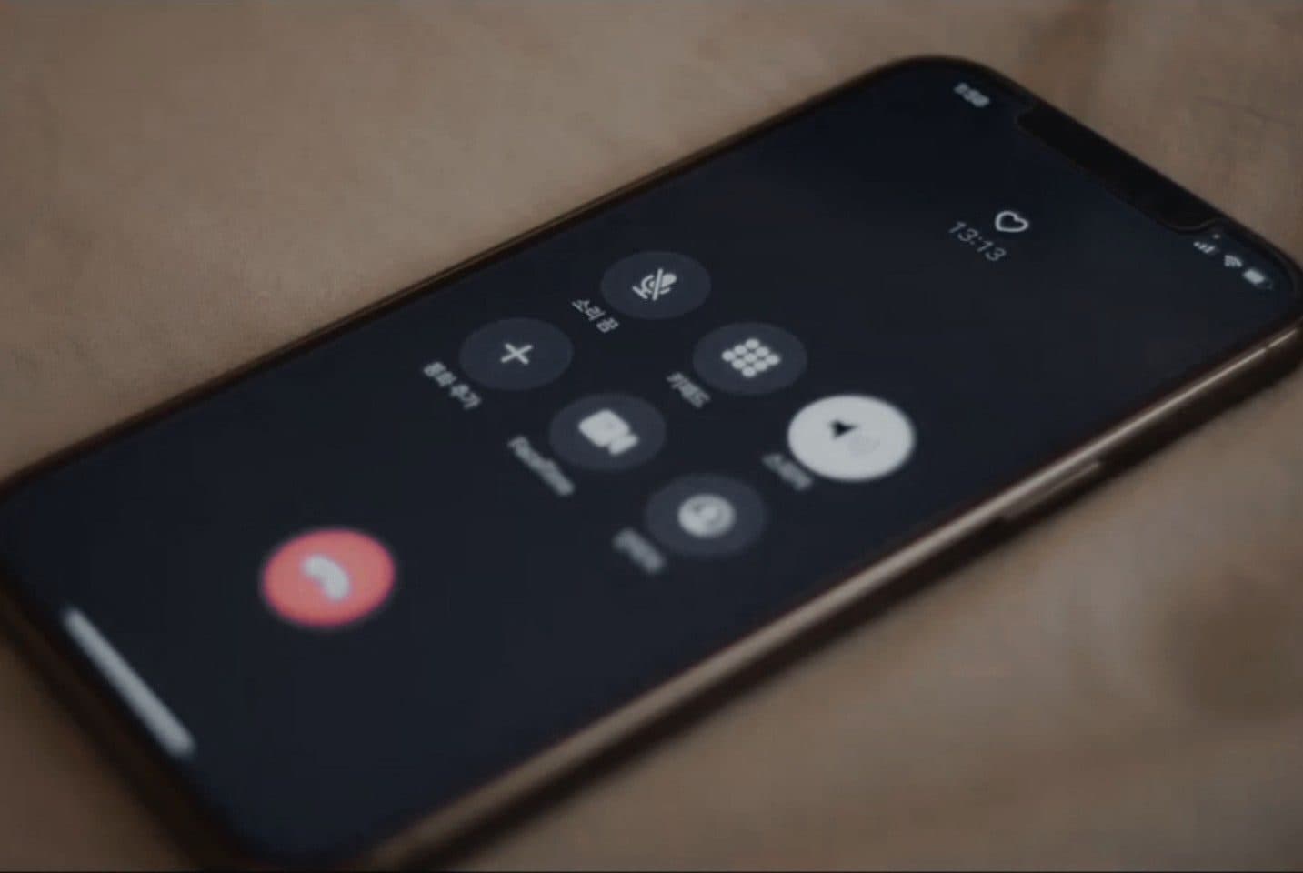 A phone lying on the bed during a voice call