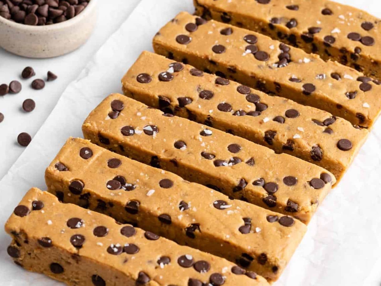 A stack of homemade protein bars on parchment paper